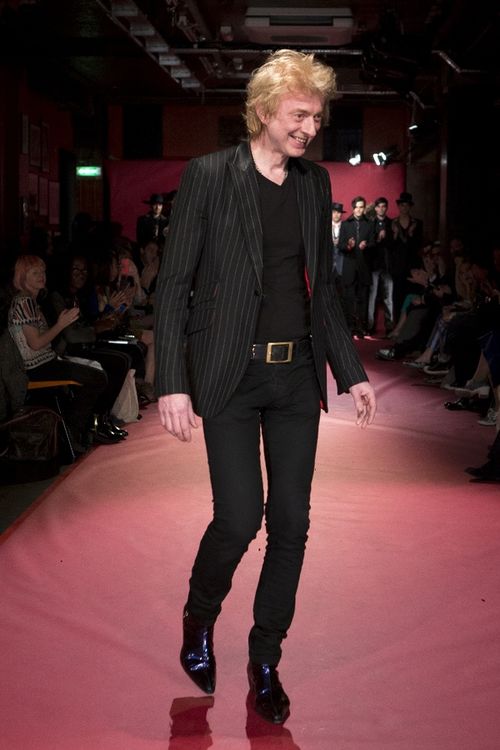 Sir Tom Baker finishing off his catwalk show at the 100 Club with a 'designers walk' in his tonic pa