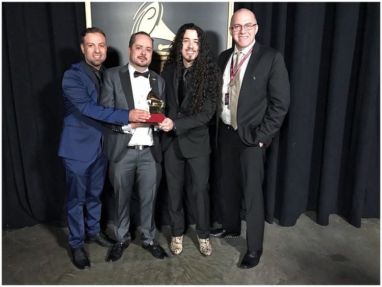 Ruben receiving his Latin Grammy in his Lynott boots